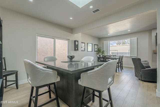 dining area with light hardwood / wood-style flooring