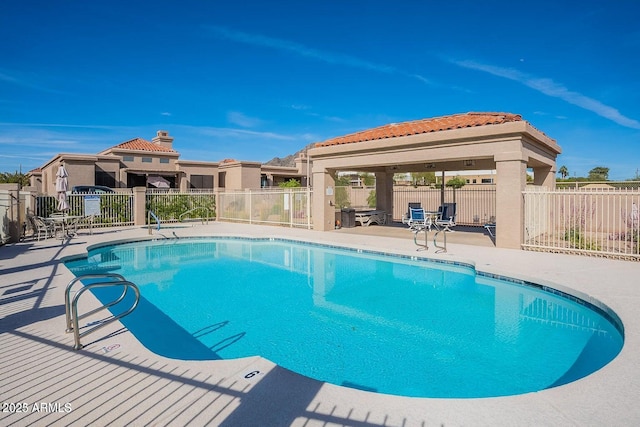 view of swimming pool featuring a gazebo and a patio