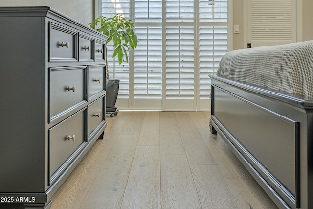 bedroom with light hardwood / wood-style floors