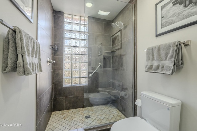 bathroom with toilet and walk in shower