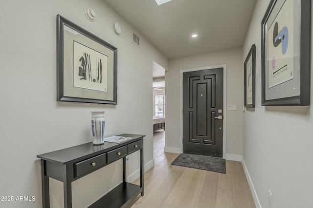 entrance foyer featuring light wood-type flooring