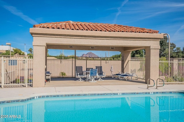 view of swimming pool with a gazebo and a patio