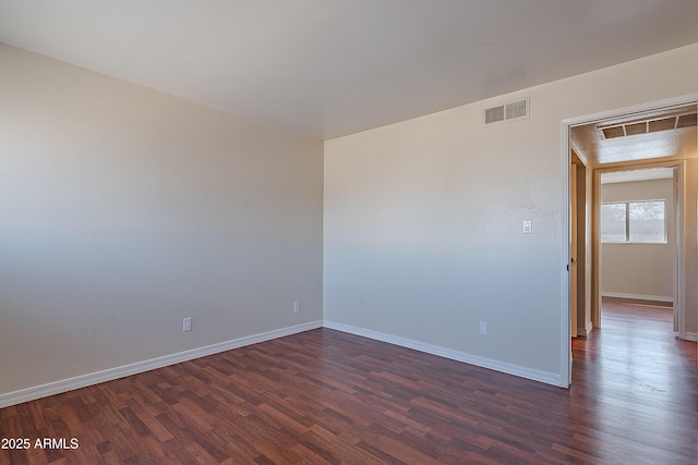 2233 W Farmdale Ave Unit 2, Mesa, AZ 85202 - empty room featuring baseboards, dark wood-style flooring, and visible vents