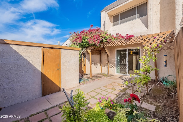2233 W Farmdale Ave Unit 2, Mesa, AZ 85202 - back of property with a patio area, stucco siding, and fence
