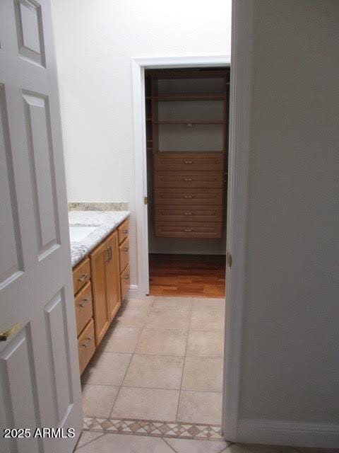 bathroom featuring tile patterned floors and vanity