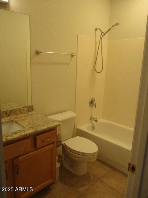 bathroom featuring toilet,  shower combination, tile patterned flooring, and vanity
