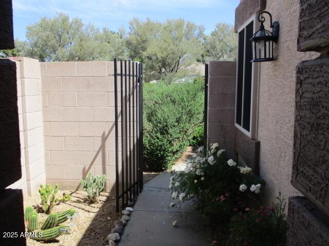 view of gate featuring fence