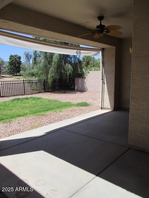 view of patio featuring a ceiling fan and a fenced backyard