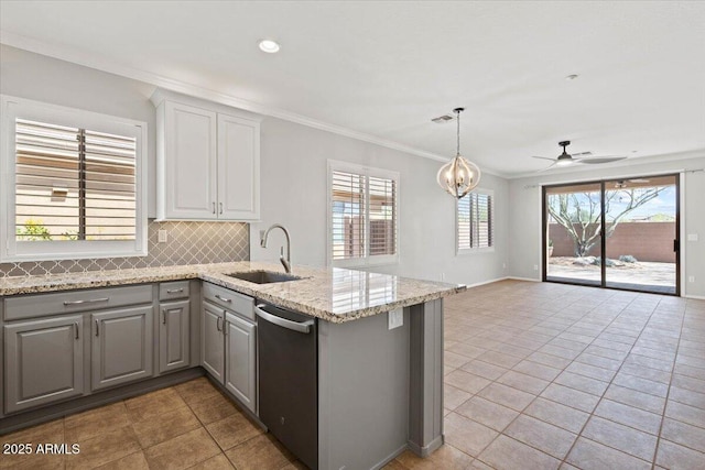 kitchen with ceiling fan, tasteful backsplash, stainless steel dishwasher, sink, and gray cabinetry