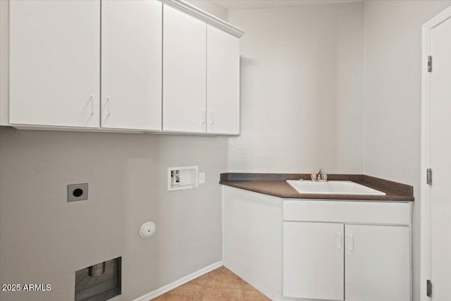 laundry area featuring light tile patterned floors, electric dryer hookup, hookup for a washing machine, cabinets, and sink