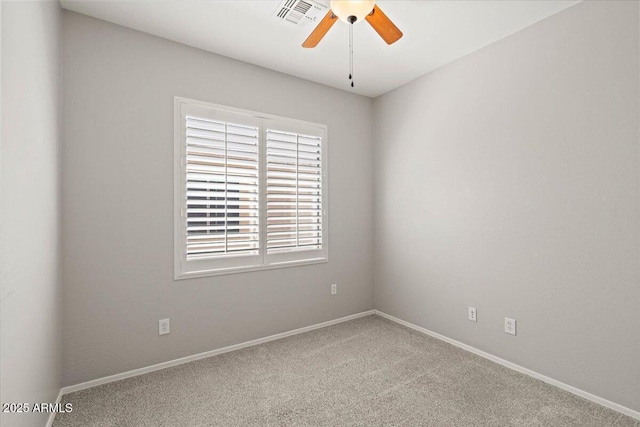 empty room with carpet and ceiling fan