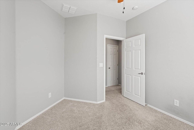 empty room with light carpet and ceiling fan