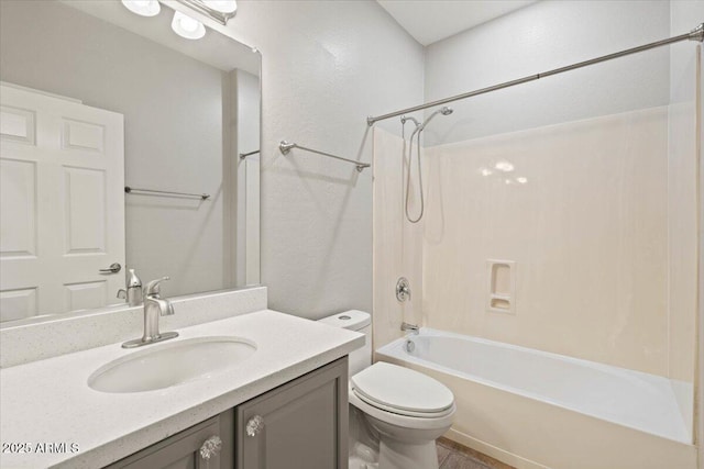 full bathroom with bathtub / shower combination, toilet, and vanity