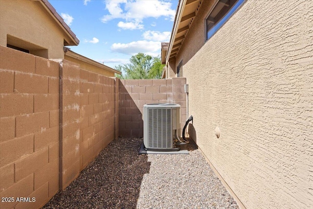 view of side of property with central AC