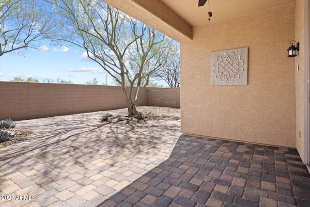 view of patio / terrace featuring ceiling fan