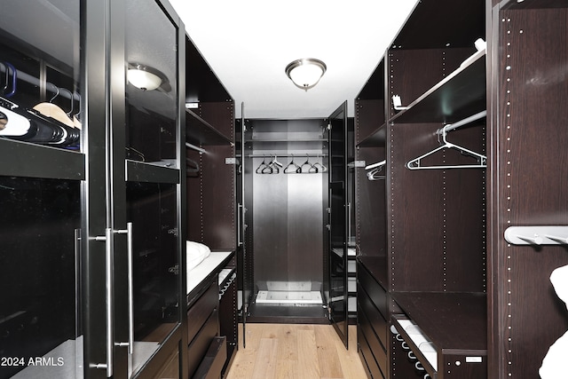 walk in closet featuring light hardwood / wood-style floors