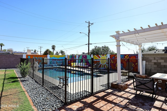 view of swimming pool with a pergola and a patio