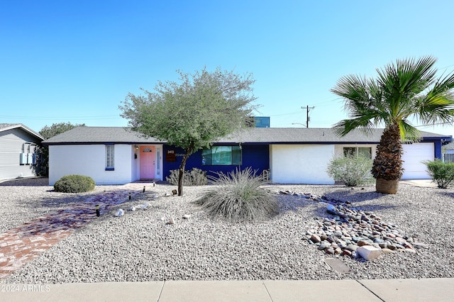 ranch-style home with a garage