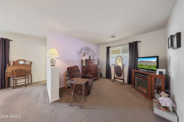 sitting room with carpet floors