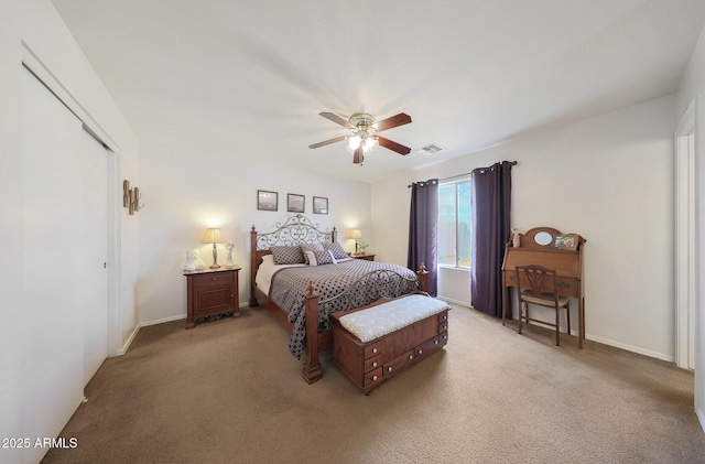 bedroom featuring light colored carpet and ceiling fan