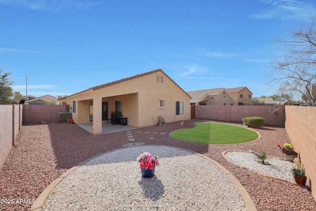 back of property with a patio area