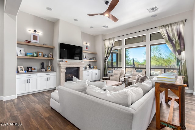 living room featuring dark hardwood / wood-style floors and ceiling fan