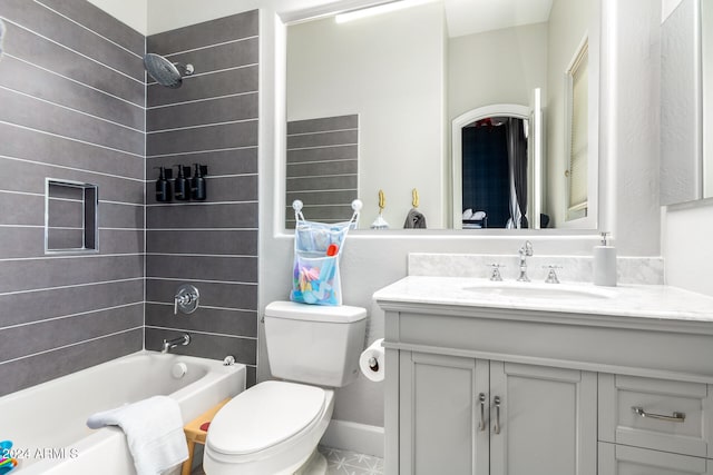 full bathroom with toilet, tiled shower / bath combo, and vanity