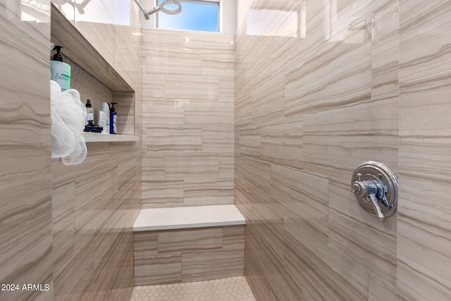 bathroom featuring tiled shower