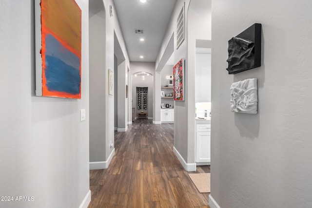 hallway featuring dark hardwood / wood-style flooring