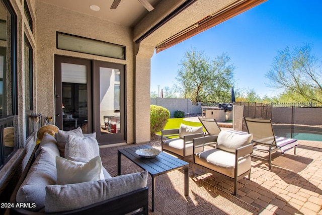 view of patio / terrace with a fenced in pool, french doors, and outdoor lounge area