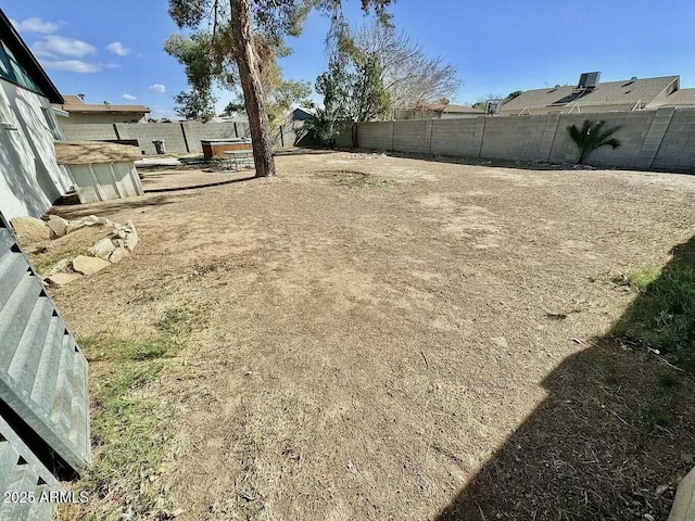 view of yard with a fenced backyard