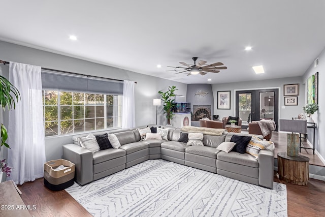 living room featuring recessed lighting and wood finished floors