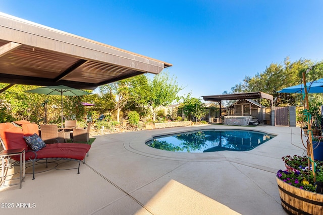 view of swimming pool with a patio, fence, and a fenced in pool