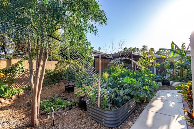 view of yard featuring a garden and fence