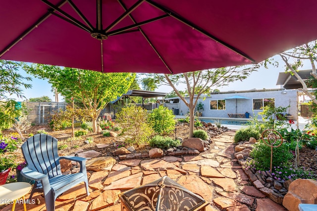 view of patio featuring fence