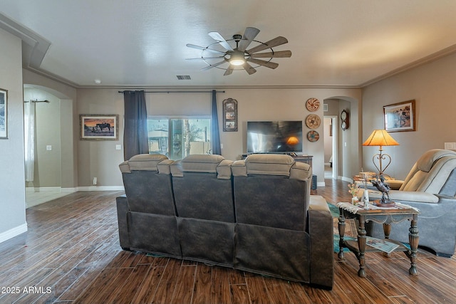 living room with crown molding, hardwood / wood-style floors, and ceiling fan