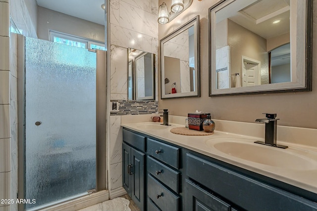 bathroom featuring vanity and backsplash