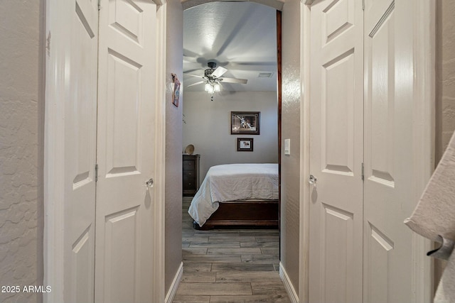 bedroom featuring ceiling fan and dark hardwood / wood-style flooring