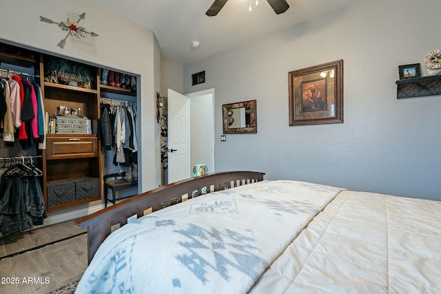 bedroom with ceiling fan and a closet