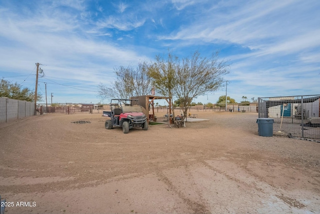 view of yard with a rural view