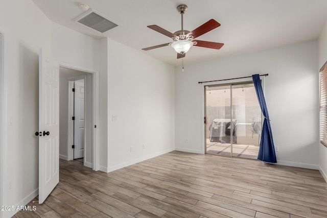 2326 E Spruce Dr, Chandler, AZ 85286 - unfurnished room with wood finished floors, ceiling fan, and baseboards