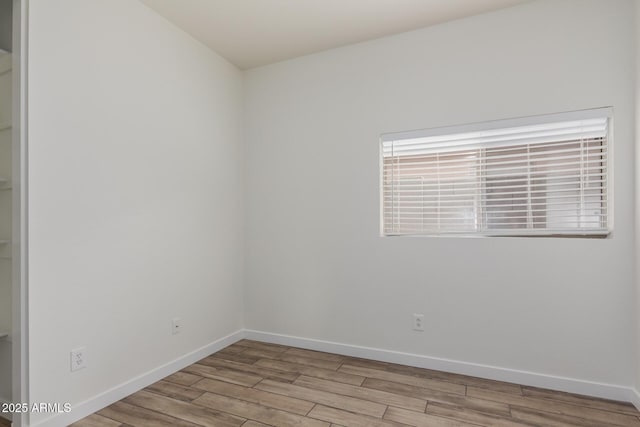 2326 E Spruce Dr, Chandler, AZ 85286 - spare room featuring wood finished floors and baseboards