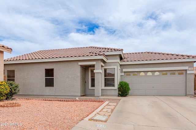 2326 E Spruce Dr, Chandler, AZ 85286 - mediterranean / spanish home with a garage, driveway, stucco siding, and a tile roof