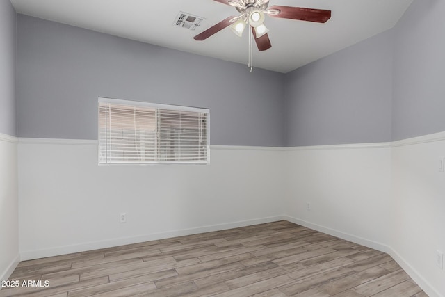 2326 E Spruce Dr, Chandler, AZ 85286 - unfurnished room with a ceiling fan, wood finished floors, and baseboards