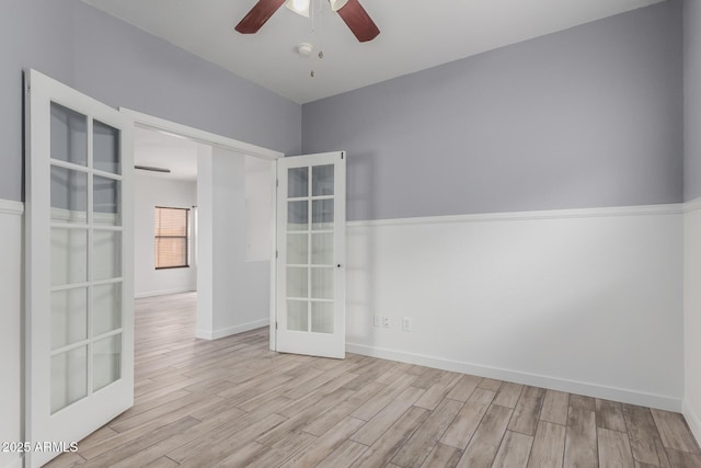 2326 E Spruce Dr, Chandler, AZ 85286 - empty room with ceiling fan, french doors, wood finished floors, and baseboards