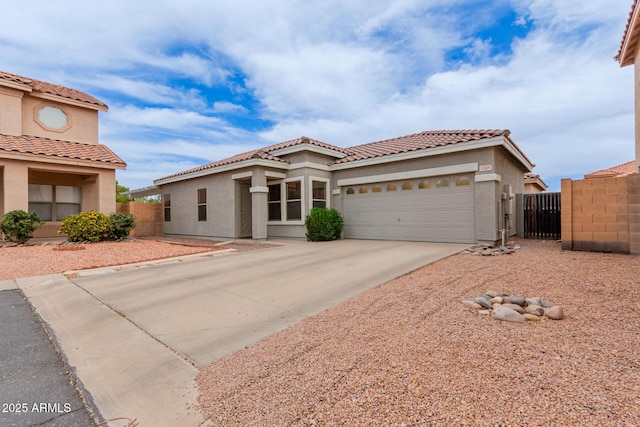 2326 E Spruce Dr, Chandler, AZ 85286 - mediterranean / spanish-style house with an attached garage, stucco siding, driveway, and a tile roof