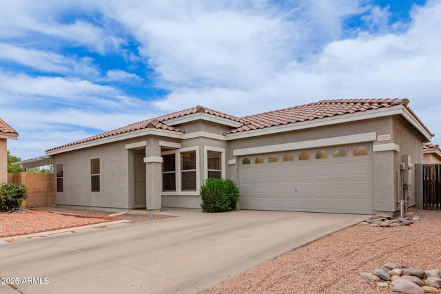 2326 E Spruce Dr, Chandler, AZ 85286 - mediterranean / spanish-style home with stucco siding, driveway, an attached garage, and a tiled roof