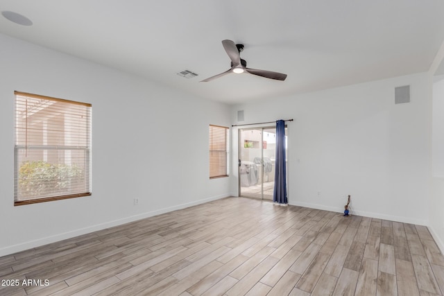 2326 E Spruce Dr, Chandler, AZ 85286 - empty room featuring ceiling fan, light wood finished floors, and baseboards