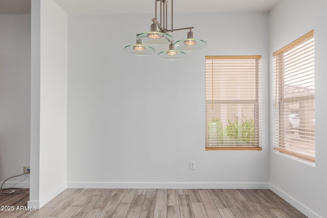 2326 E Spruce Dr, Chandler, AZ 85286 - unfurnished dining area with wood finished floors and baseboards