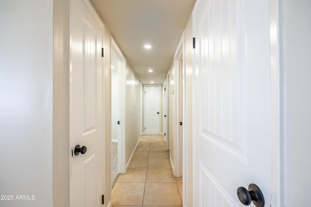 hallway featuring light tile patterned floors and recessed lighting